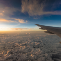 an airplane wing above clouds