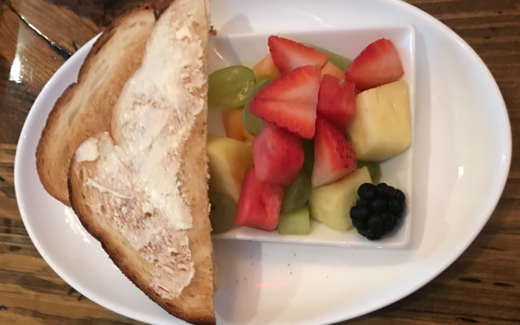 a plate of fruit and bread