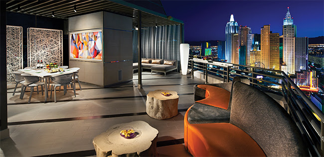 a rooftop patio with a view of a city
