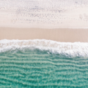 a beach with waves and sand