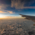 an airplane wing above clouds