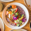 a bowl of food with flowers