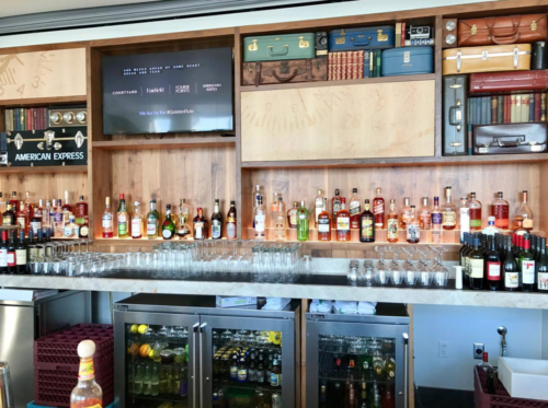 a bar with bottles and glasses