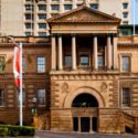 a building with columns and a flag