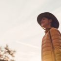 a woman in a hat and coat