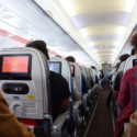 a group of people sitting in an airplane