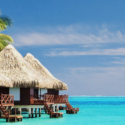 a bungalows on stilts in the water