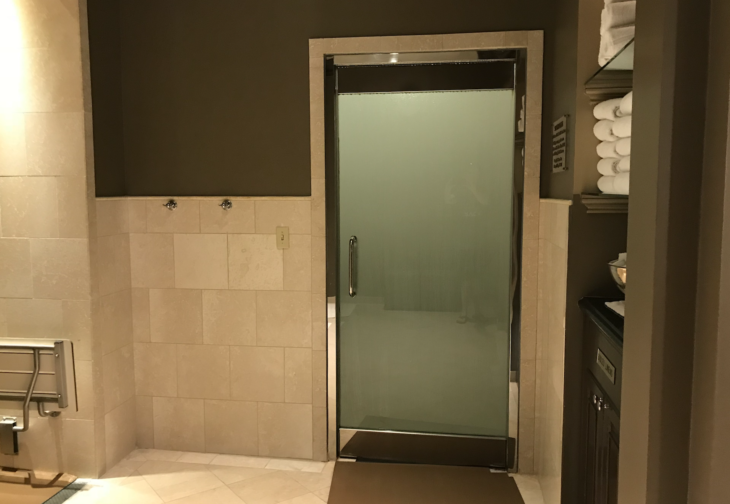 a glass door in a bathroom