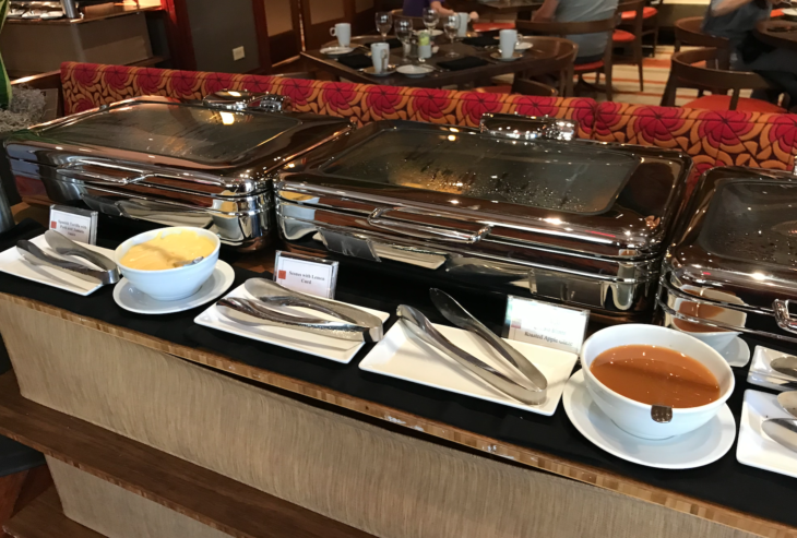 a buffet set up with food on a table