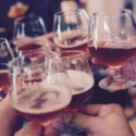 a group of people holding wine glasses