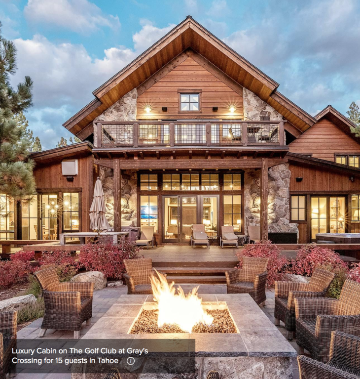a large house with a fire pit