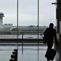 a man with luggage in airport