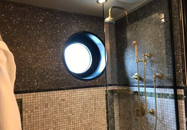 a shower with a round window
