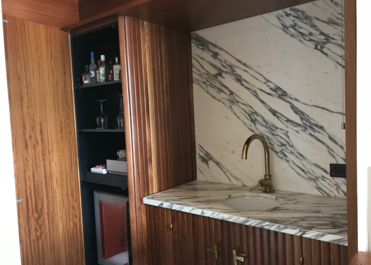 a sink and shelves in a room