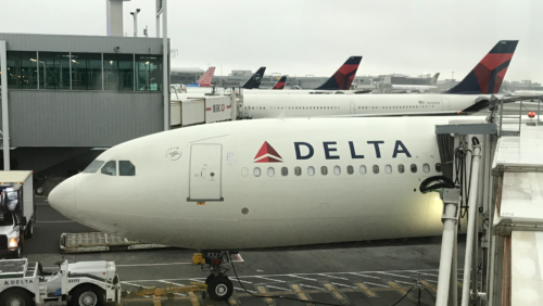 a group of airplanes at an airport