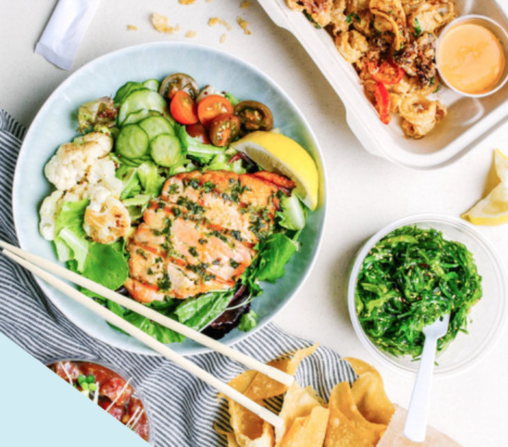 food in a bowl with chopsticks