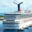 a cruise ship docked at a dock