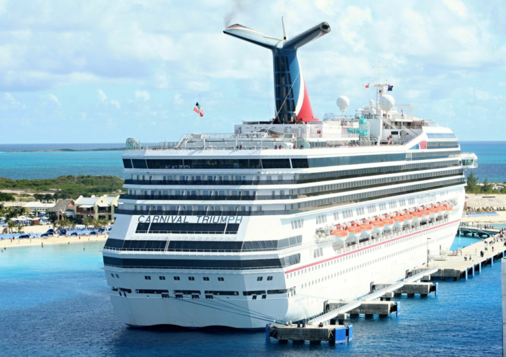 a cruise ship docked at a dock