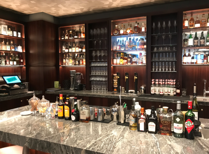 a bar with liquor bottles and glasses