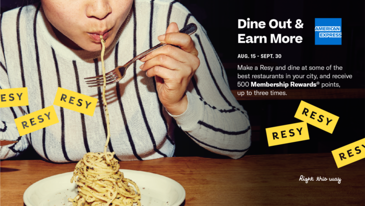 a woman eating spaghetti with a fork