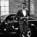 a man in a suit and a car