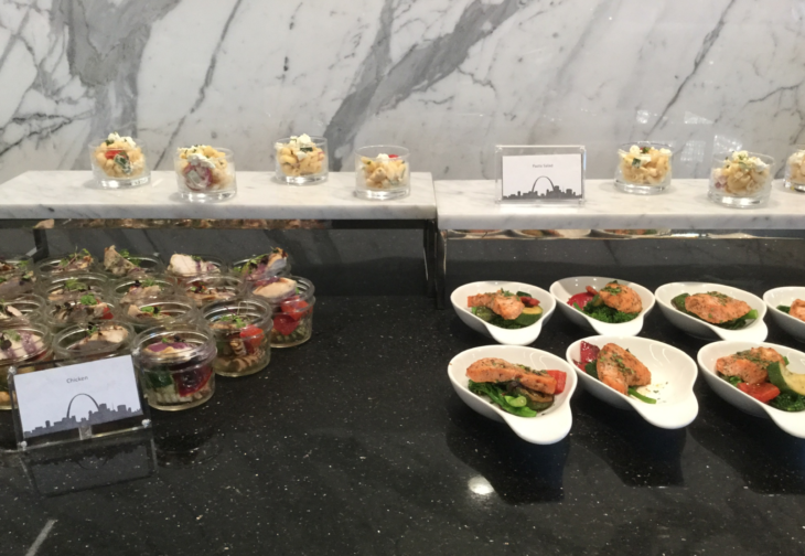 a buffet table with food in bowls