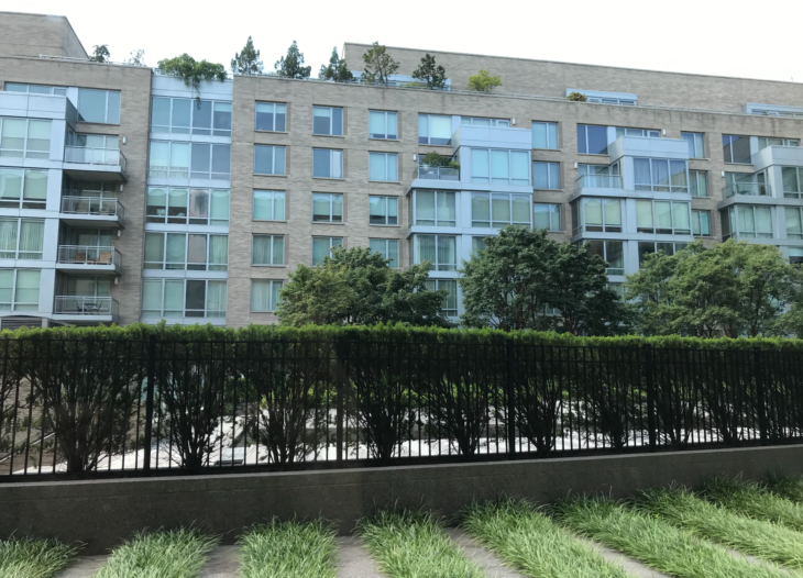 a building with trees and grass