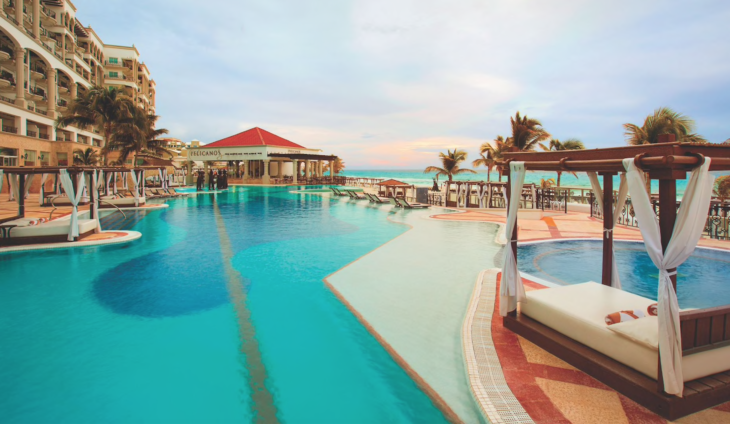 a pool with a bar and chairs