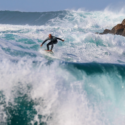 a man surfing in the ocean