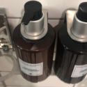 a couple of brown bottles with black labels