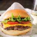 a cheeseburger wrapped in paper