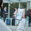 a woman holding a cell phone