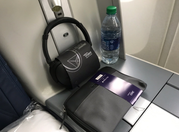 a bag and headphones on a seat