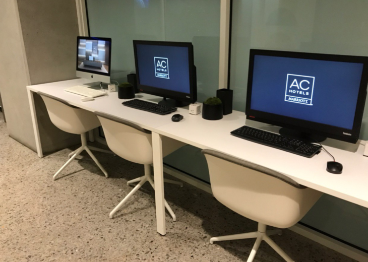 a row of computers on a table