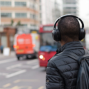 a man wearing headphones on his back