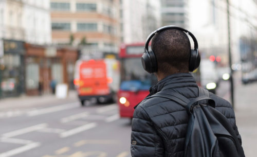 a man wearing headphones on his back