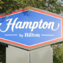 a blue and red sign with white text