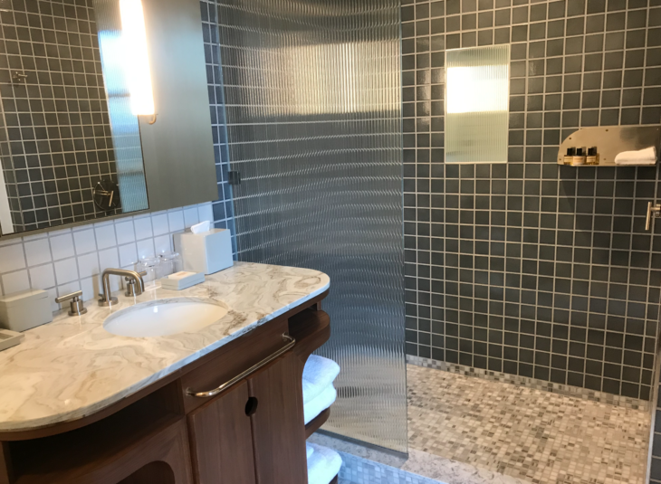 a bathroom with a shower and sink