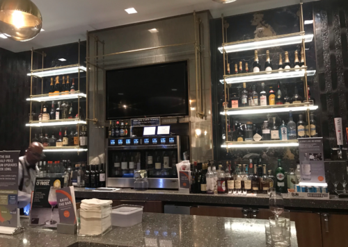 a bar with shelves of liquor