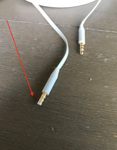a white wire with gold tips