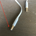 a white wire with gold colored connectors