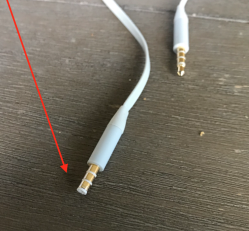 a white wire with gold colored connectors