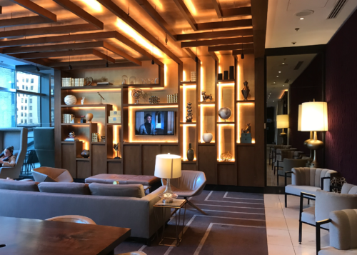 a room with a tv and shelves