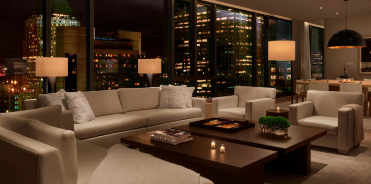 a living room with a view of the city