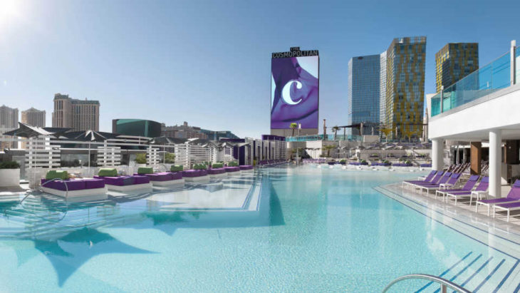 a pool with a large sign in the background