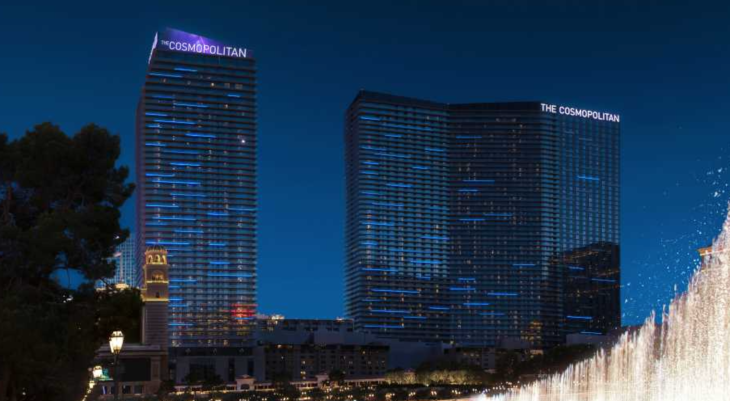 a tall buildings lit up at night