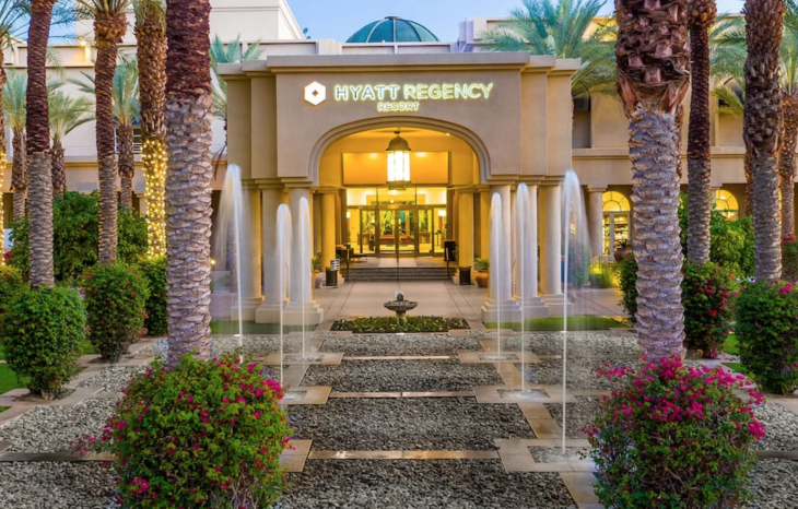 a building with water fountains in front of it