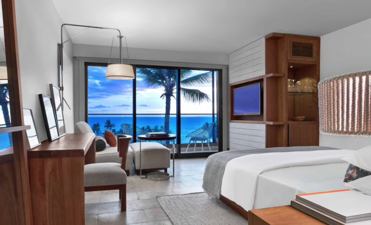 a room with a large window overlooking the ocean