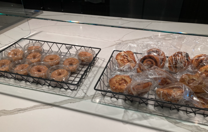 past pastries wrapped in plastic on a counter