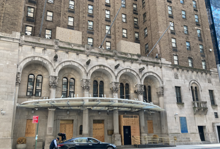 a man standing in front of a building